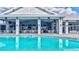 Poolside bar and grill with ample seating, perfect for enjoying refreshments by the pool at 4968 Seafoam Trl, Bradenton, FL 34211