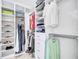 A spacious walk-in closet offers ample storage space with built-in shelving and hanging rods for organized storage at 4968 Seafoam Trl, Bradenton, FL 34211