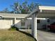Charming single-story home with white exterior, carport, well-kept lawn, and inviting front entrance at 6024 Arlene Way, Bradenton, FL 34207