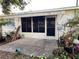 Exterior view of a screened patio with concrete floors and awning at 6024 Arlene Way, Bradenton, FL 34207