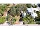 An aerial view of home, highlighting its proximity to lush greenery, pool, and landscaping at 617 35Th W St, Bradenton, FL 34205
