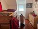 Bedroom with hardwood floors, a bed, dresser, and natural light at 617 35Th W St, Bradenton, FL 34205