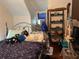 Bedroom featuring a bed, shelving unit and unique decorative items at 617 35Th W St, Bradenton, FL 34205