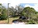 Inviting single-story home with a well-maintained lawn, mature trees, and classic architectural charm at 617 35Th W St, Bradenton, FL 34205