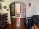 View of a detailed archway in a home leading down a hallway and through a doorway at 617 35Th W St, Bradenton, FL 34205