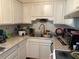 Functional kitchen featuring white cabinets and a stainless steel sink at 617 35Th W St, Bradenton, FL 34205