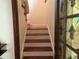 Classic staircase with wooden steps leading to the upper level at 617 35Th W St, Bradenton, FL 34205