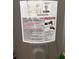 Close-up of the water heater with detailed specifications and safety warnings at 617 35Th W St, Bradenton, FL 34205