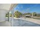 Waterfront backyard featuring a boat dock and lift and direct access to the residence via sliding glass doors at 619 Buttonwood Dr, Longboat Key, FL 34228