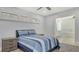 Comfortable bedroom with a queen bed and an en-suite bathroom that features a soaking tub and a double vanity at 619 Buttonwood Dr, Longboat Key, FL 34228