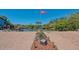 Wide angle view of a brick paved dock with the American flag and canal in background at 619 Buttonwood Dr, Longboat Key, FL 34228