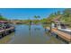 Boat basin with boats on docks on a calm day at 619 Buttonwood Dr, Longboat Key, FL 34228