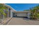 A well-maintained home with a large driveway, ample parking, and a two-car garage at 619 Buttonwood Dr, Longboat Key, FL 34228