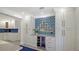 Stylish kitchen details with a wine cooler and elegant blue backsplash at 619 Buttonwood Dr, Longboat Key, FL 34228