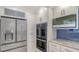 The modern kitchen features stainless steel appliances and ample cabinet space at 619 Buttonwood Dr, Longboat Key, FL 34228