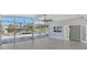 Open living room with modern flooring and sliding glass doors to backyard at 619 Buttonwood Dr, Longboat Key, FL 34228