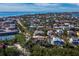 Waterfront homes and canals in a picturesque aerial view with beautiful sunny skies at 650 Penfield St, Longboat Key, FL 34228