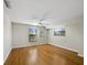 Bright bedroom features two windows, bamboo floors, a ceiling fan, and neutral paint throughout at 650 Penfield St, Longboat Key, FL 34228