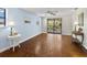 Bright bedroom with a sliding door leading to a balcony, and ample sunlight and minimalist decor at 650 Penfield St, Longboat Key, FL 34228
