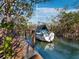 Boat on a lift, ready for a great day of boating on the canal at 650 Penfield St, Longboat Key, FL 34228