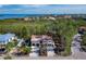 Inviting exterior elevation of home near the water and lush greenery at 650 Penfield St, Longboat Key, FL 34228