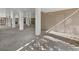 The lower level features painted support columns, a gravel floor, and a door at 650 Penfield St, Longboat Key, FL 34228