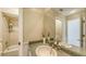 Bathroom with granite countertops, decorative plants, and a shower/tub combo at 710 Birdsong Ln, Sarasota, FL 34242