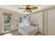 Bright bedroom featuring natural light, a pull-down Murphy bed, and a built-in closet at 710 Birdsong Ln, Sarasota, FL 34242