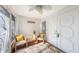 Comfortable foyer space featuring wicker furniture, tile floors, and a ceiling fan at 710 Birdsong Ln, Sarasota, FL 34242
