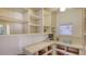 Walk in pantry with custom shelving, storage and countertop space at 710 Birdsong Ln, Sarasota, FL 34242