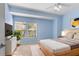 Serene primary bedroom with ample natural light and neutral tones at 7632 Plantation Cir, Bradenton, FL 34201