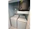 Convenient laundry room with a washer, dryer, and shelving for storage at 7632 Plantation Cir, Bradenton, FL 34201