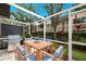 Outdoor patio with dining set and grill, perfect for entertaining at 7632 Plantation Cir, Bradenton, FL 34201