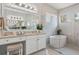 Bright and modern bathroom with a soaking tub, dual vanities, granite counters and a glass shower at 8271 Redonda Loop, Lakewood Ranch, FL 34202