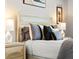Bedroom features a well-made bed and side table with lamps at 8271 Redonda Loop, Lakewood Ranch, FL 34202