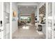 Bright foyer with polished tile floors and views of the spacious living area at 8271 Redonda Loop, Lakewood Ranch, FL 34202