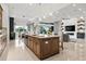 Open-concept kitchen with center island, seamlessly connecting to living and dining areas at 8271 Redonda Loop, Lakewood Ranch, FL 34202