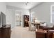 Bright home office featuring a desk, bookshelves, and a comfortable chair at 8271 Redonda Loop, Lakewood Ranch, FL 34202