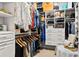 Spacious walk-in closet with custom shelving, drawers, and hanging space for organized storage of clothing and accessories at 8271 Redonda Loop, Lakewood Ranch, FL 34202