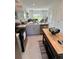 Eat-in kitchen with stainless steel appliances open to living space at 8949 Daybreak St, Sarasota, FL 34241