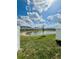 Scenic backyard view featuring a pond and well-maintained lawn at 8949 Daybreak St, Sarasota, FL 34241