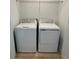 Convenient laundry area with side-by-side washer and dryer and shelving at 8949 Daybreak St, Sarasota, FL 34241