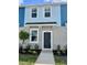 Charming two-story townhome with well-maintained landscaping and welcoming front entrance at 8949 Daybreak St, Sarasota, FL 34241