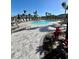 Resort-style pool with lounge chairs and lush tropical landscaping, perfect for relaxation at 8949 Daybreak St, Sarasota, FL 34241