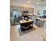 Modern kitchen with stainless steel appliances and large island at 8949 Daybreak St, Sarasota, FL 34241