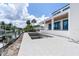 Spacious backyard featuring an in-ground pool, outdoor kitchen and access to the water at 927 Contento St, Sarasota, FL 34242