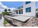 Wide backyard featuring a new pool, in-ground pool, and access to a waterfront canal at 927 Contento St, Sarasota, FL 34242