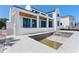 Spacious backyard of a new construction home with patio, in-ground pool, and outdoor staircase at 927 Contento St, Sarasota, FL 34242