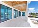 A spacious balcony with modern tile floors overlooking water and other neighborhood houses at 927 Contento St, Sarasota, FL 34242