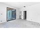 A bright bedroom with a large sliding glass door and interior doors at 927 Contento St, Sarasota, FL 34242